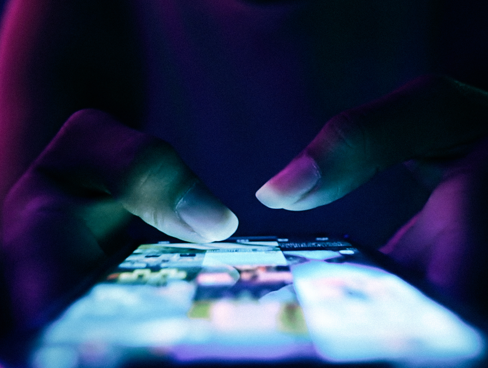 Close-up of smartphone displaying digital media content representing Arabian Business social channels.