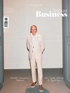 Arabian Business cover portrait of executive in light suit.