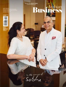 Arabian Business magazine cover featuring business leaders in conversation.