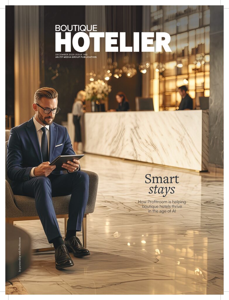 Boutique Hotelier magazine cover featuring hotel executive in luxury lobby setting.