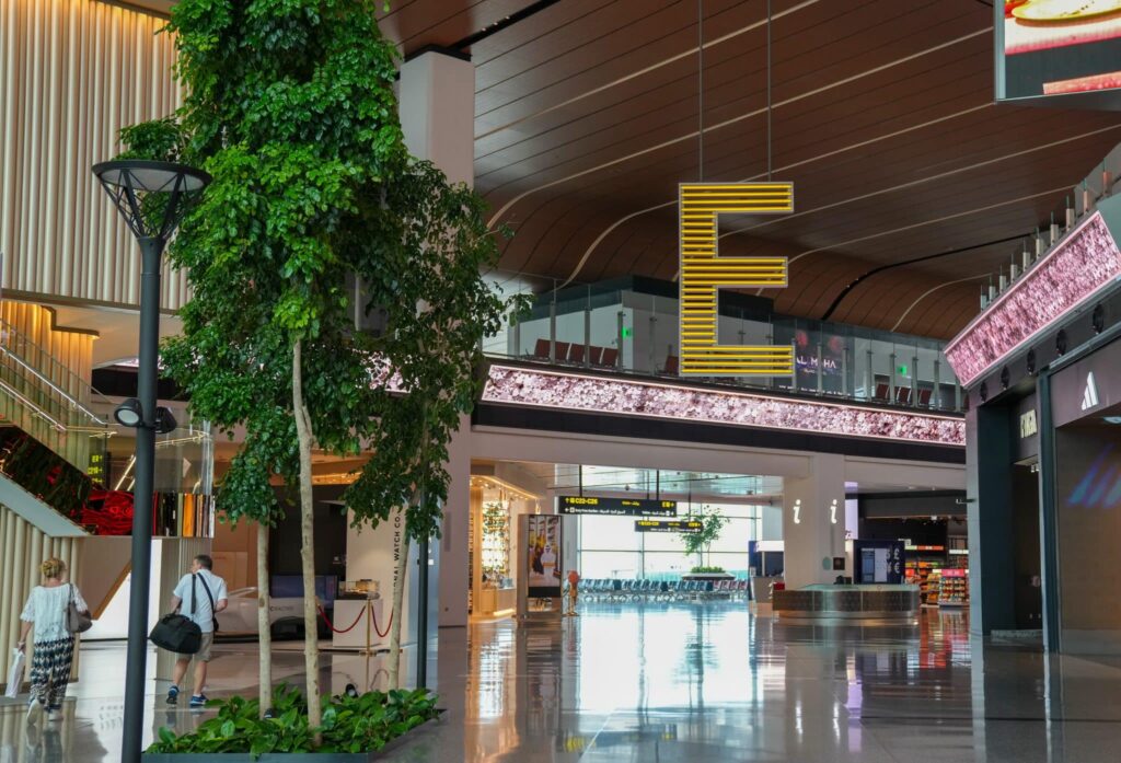 Modern airport terminal interior in the Middle East representing aviation industry growth and infrastructure development.