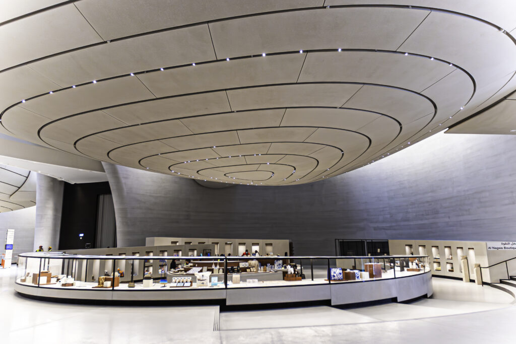 Zayed National Museum with curved ceiling panels and a circular layout, showcasing architectural design and filmed project walkthroughs.