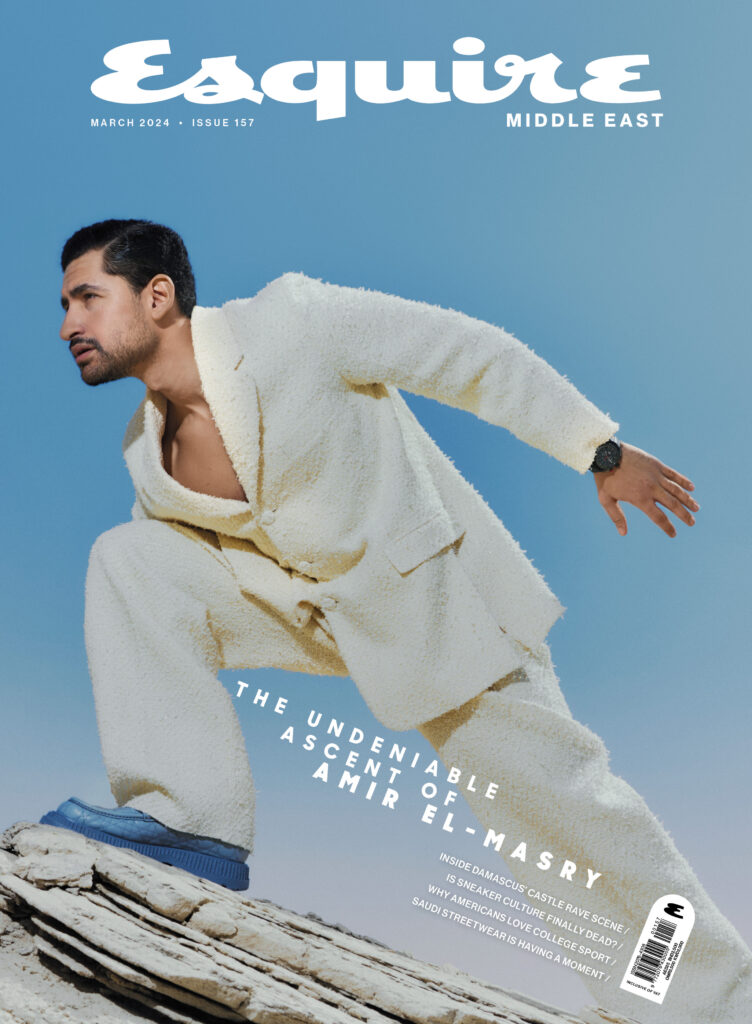 Esquire Middle East magazine cover featuring a male model in a white outfit posed outdoors in a minimalist landscape.
