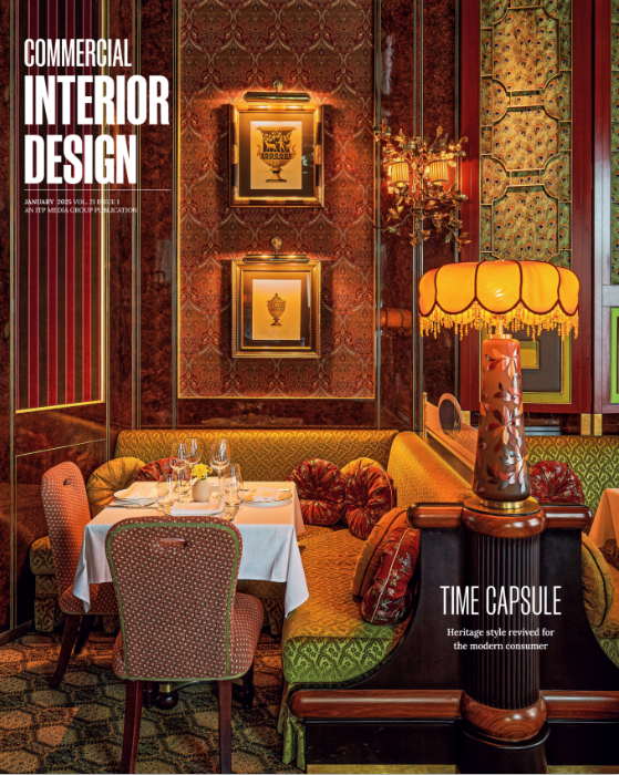 A magazine cover showing an opulent interior space with warm lighting, decorative wall panels, and elegant furniture.