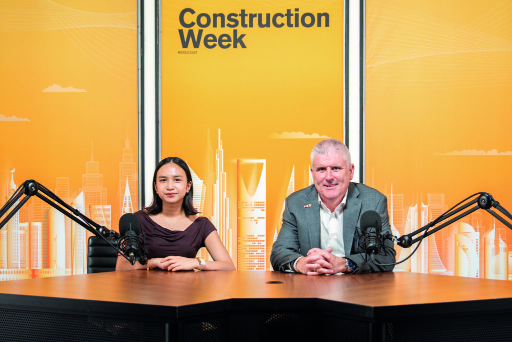 Podcast recording setup with industry professionals discussing construction and infrastructure news.