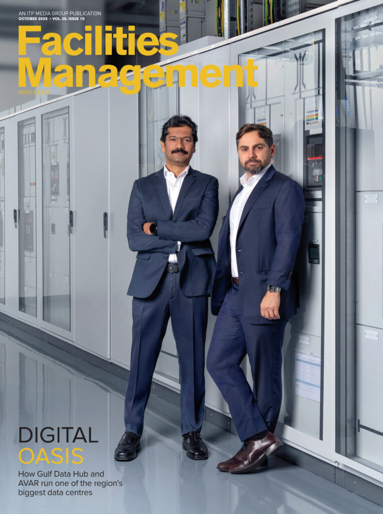 Facilities Management Middle East magazine cover featuring corporate leaders in a modern office environment.