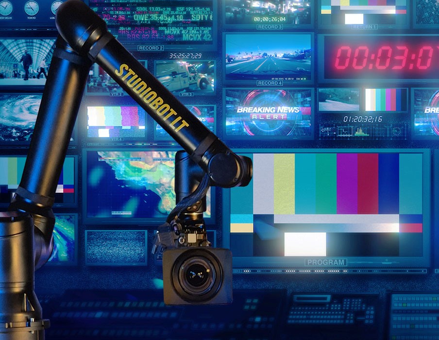 Robotic broadcast camera arm operating in front of multiple video monitors inside a professional control room representing Digital Studio India media innovation.