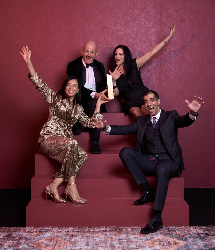 Construction professionals celebrating at an awards event hosted by Construction Week Middle East.