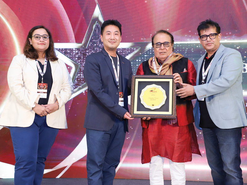 Media professionals holding awards on stage during a Digital Studio India industry event celebrating broadcast and production excellence.
