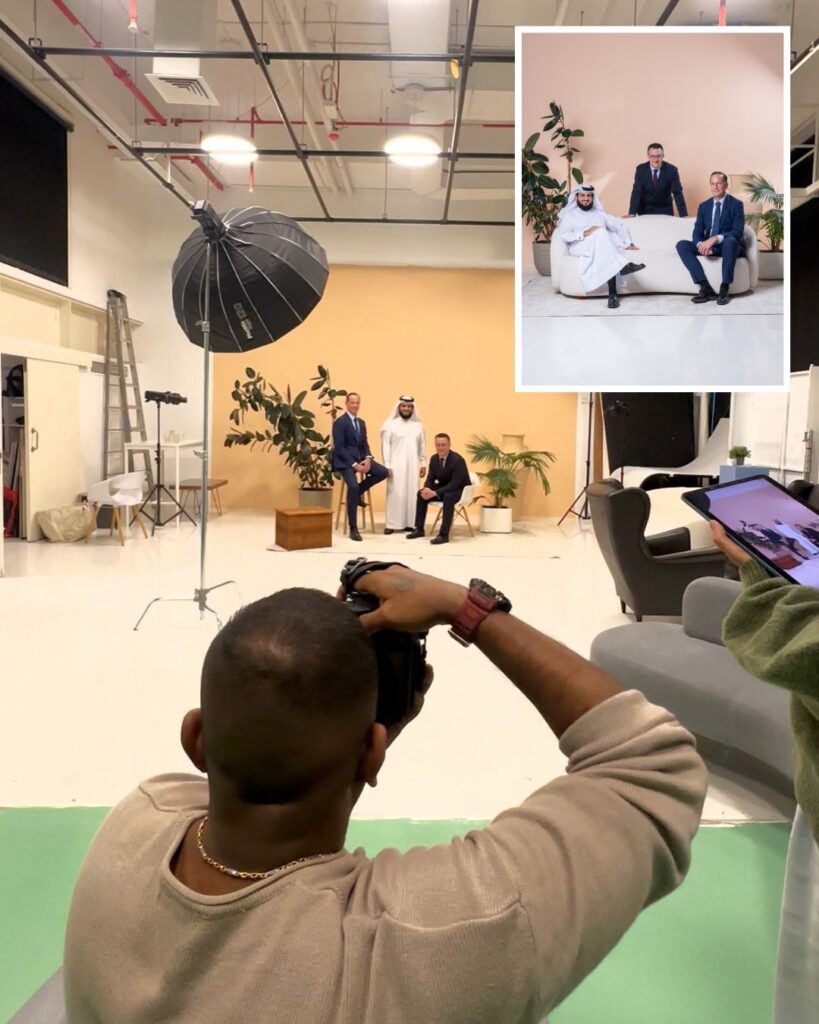 Photographer capturing executives during a professional studio photoshoot representing Facilities Management Middle East editorial and brand partnerships.