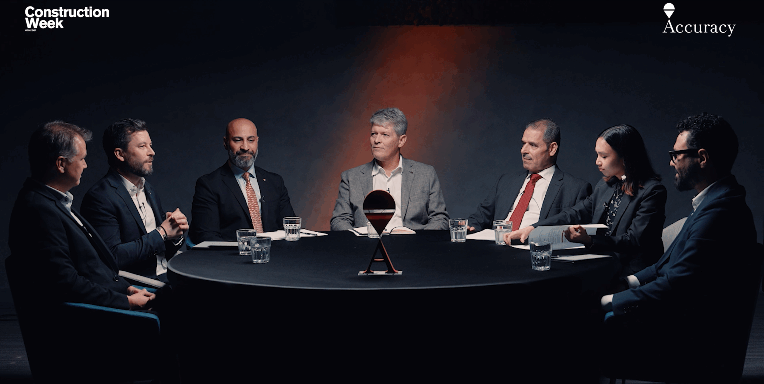 Professional executive portrait in dramatic red lighting symbolising authority and innovation in the construction industry.